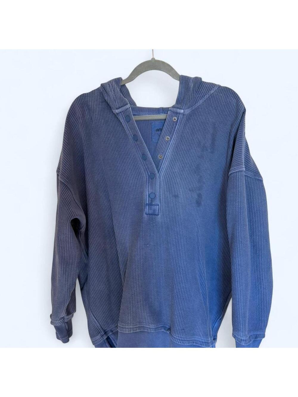 Blue Aerie sweater with a unique stain